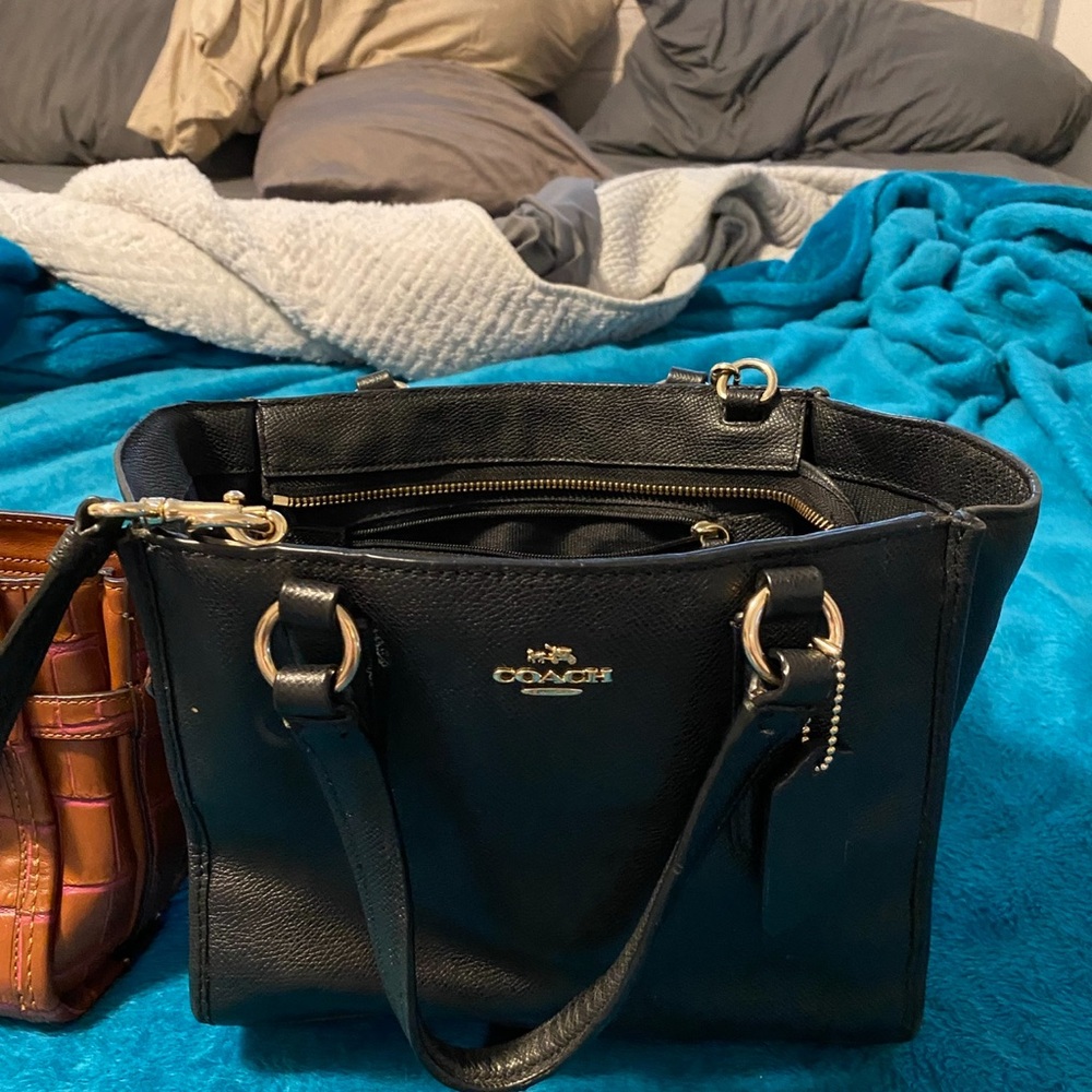 2 coach purses and a handmade leather purse and matching wallet.